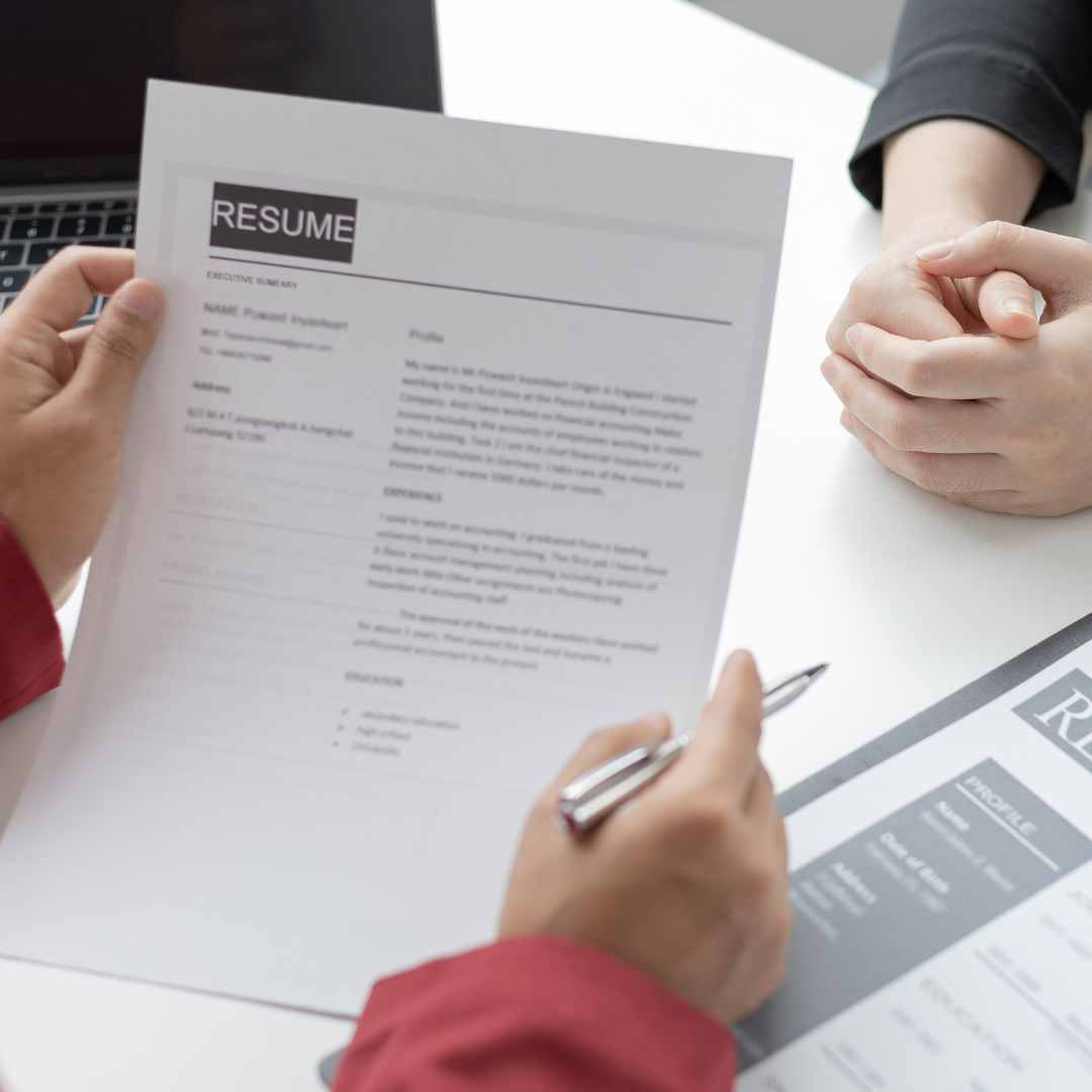 Person reviewing resume with another person