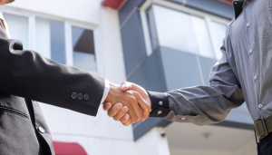 Two men buyer seller handshake